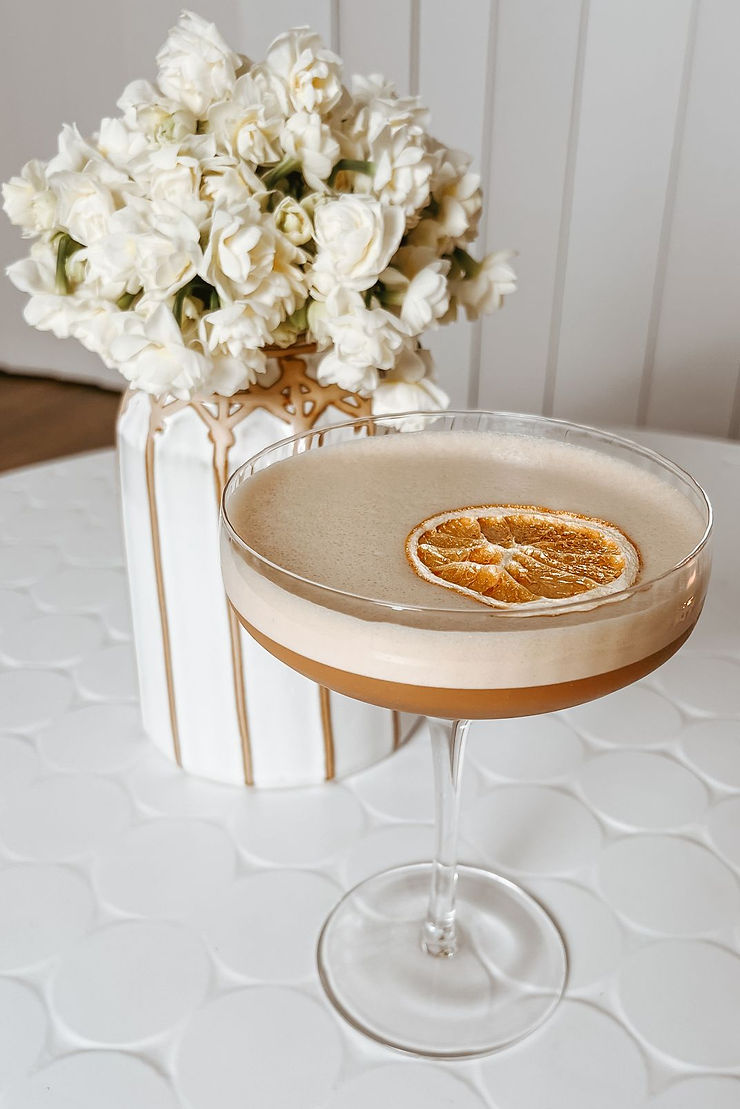 Espresso martini with orange garnish