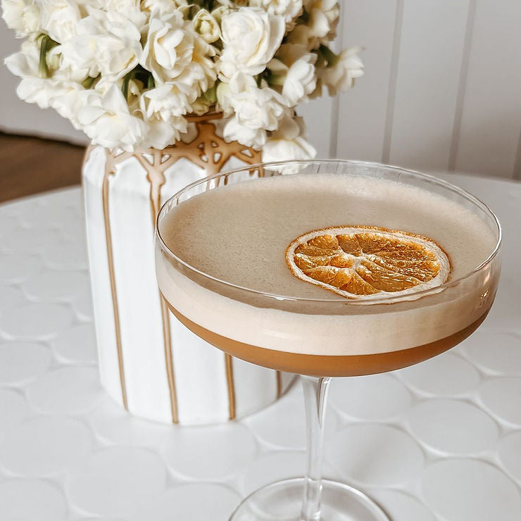 Espresso martini with orange garnish