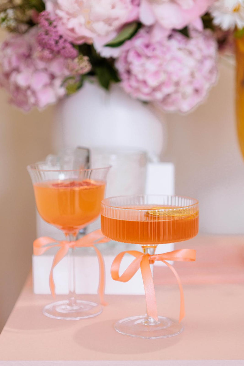 cocktails that are elevated with garnishes and ribbon