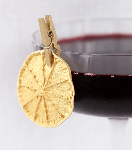 cocktail garnish attached to glass rim