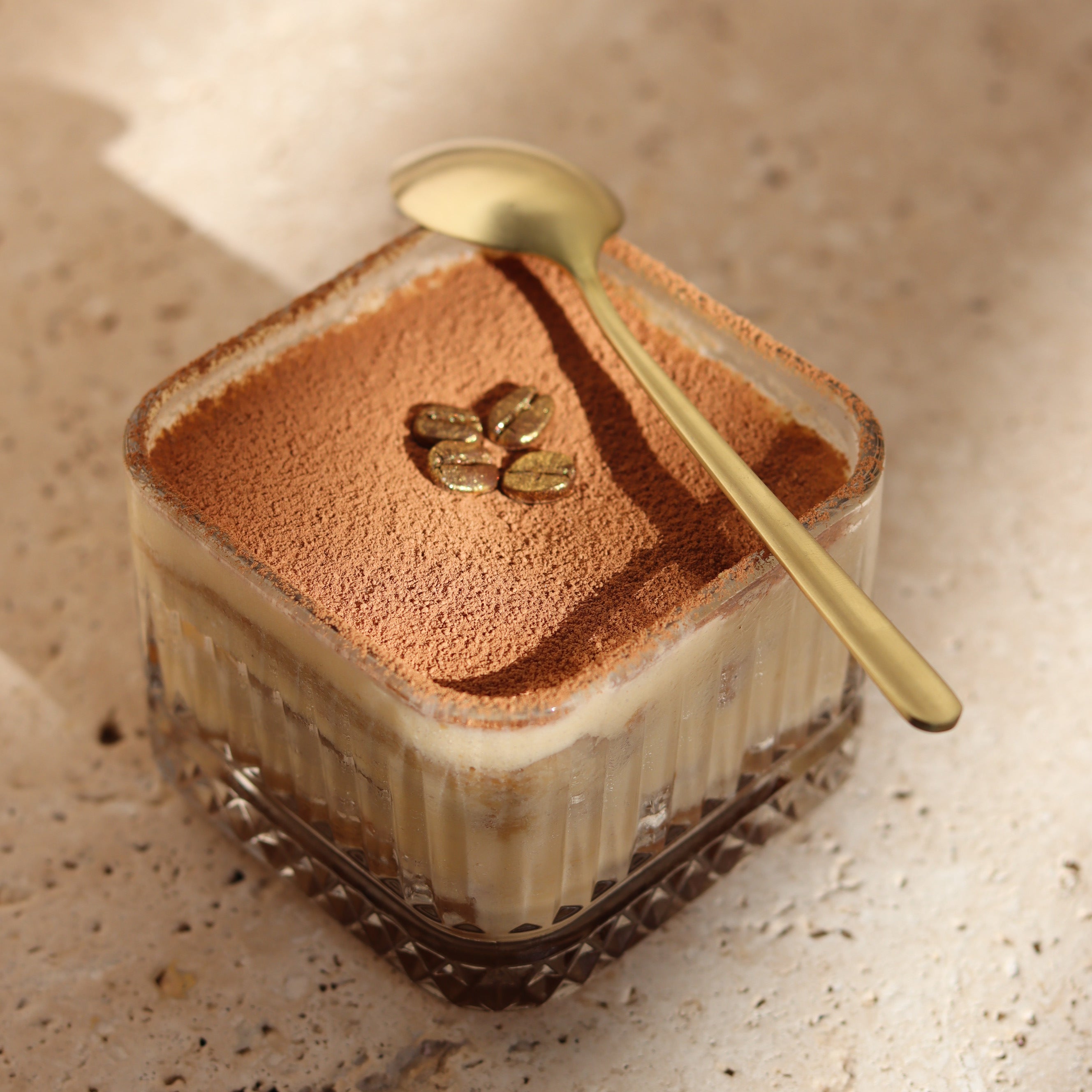 tiramisu garnished with gold coffee beans