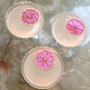 Cocktails garnishes with pink lemon garnieshes