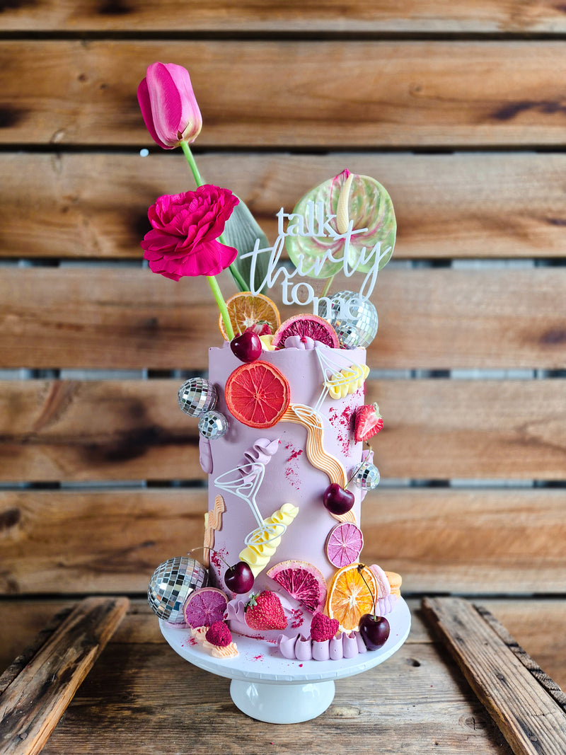 Birthday cake decorated with dried fruits 
