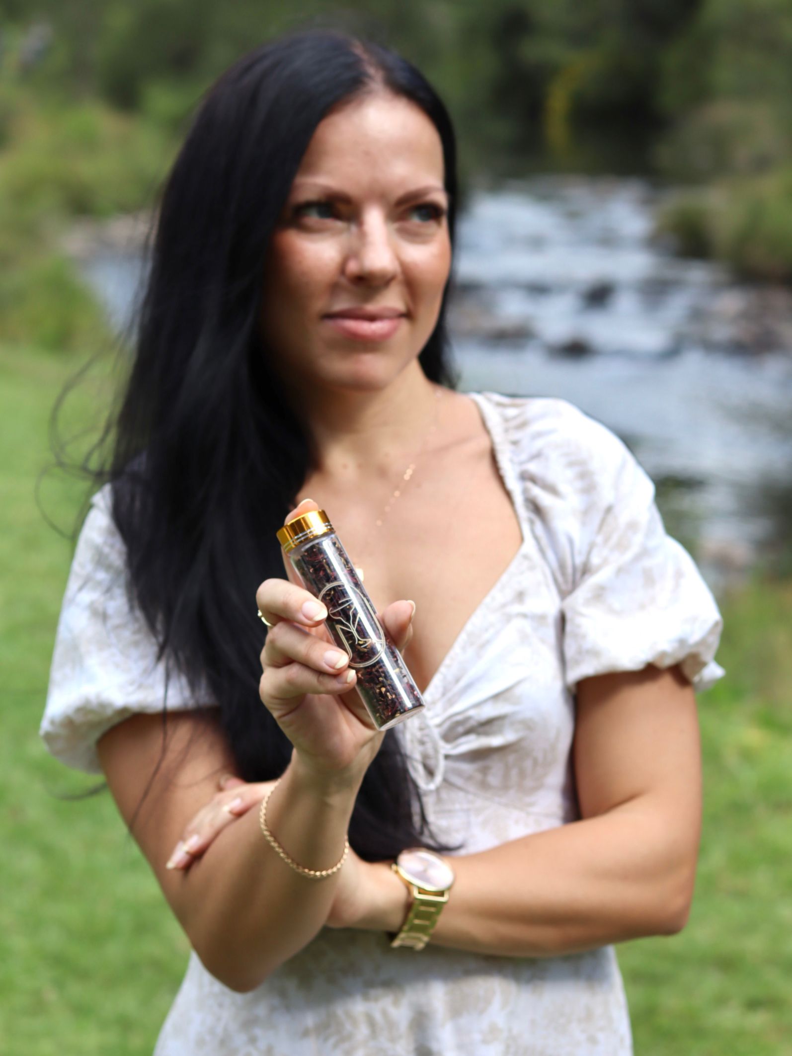 Mixso founder holding a glass jarof cocktail garnishes